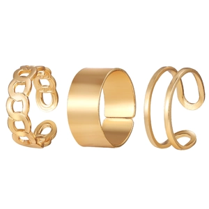 Macro detail of 3-piece gold adjustable ring set featuring chain and wide band textures