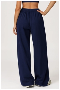 Rear view of dark blue wide-leg sweatpants featuring an elastic waist and loose fit
