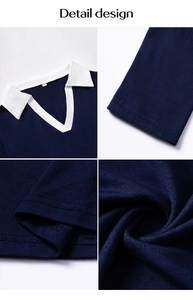 Macro detail showing navy blue knit fabric, white lapel collar, and stitching craftsmanship