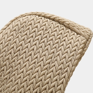 Close-up of beige quilted texture on a warm winter aviator hat with V-shaped stitching
