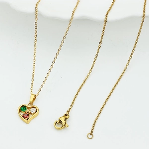 Gold heart pendant necklace with green, white, and red crystals on an O-chain link