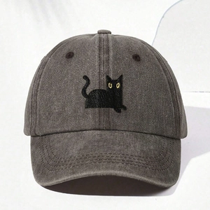 Detailed close-up of a black cat embroidery on a gray washed cotton baseball cap
