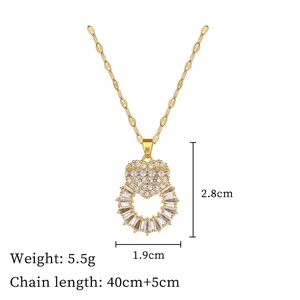 Detailed view of heart pendant with crystal stones and size parameters 2.8cm by 1.9cm