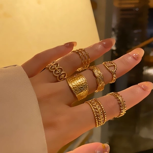 Set of minimalist 18k gold plated stainless steel rings with braided and geometric patterns
