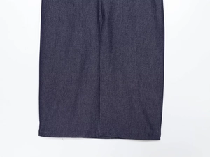 Detailed view of dark blue denim midi dress stitching and twill fabric texture