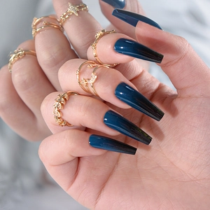 Long almond press-on nails with dark blue to black gradient finish for women