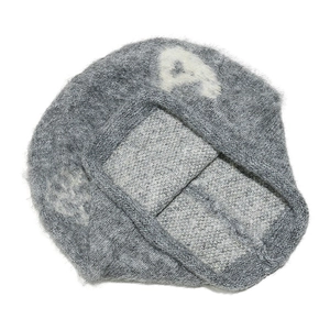 Detailed view of grey mohair knit beanie featuring a white letter A jacquard pattern