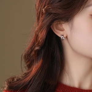 18k gold plated double hoop earrings with cubic zirconia star charms worn by model