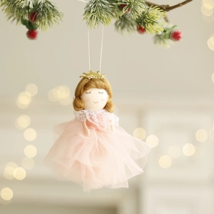 Pink Christmas angel doll ornament with gauze dress and gold crown on festive pine branch