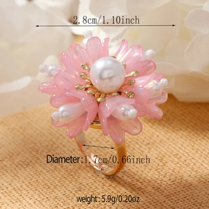 Macro detail of woven pink flower ring with pearls and size dimensions in inches