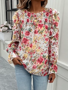 Close-up of floral print blouse with ruffle sleeves and elastic pleated chest detail