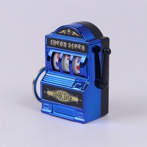 Detailed side view of blue mini slot machine keychain with manual lever and fruit reels