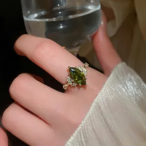 Vintage 14K gold plated ring with oval emerald gemstone and pavé zircon accents