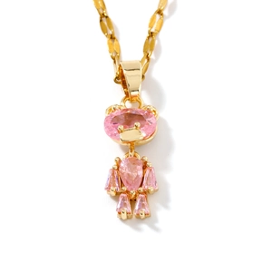 Chic gold chain necklace featuring a pink faceted bear pendant with a tiny crown detail
