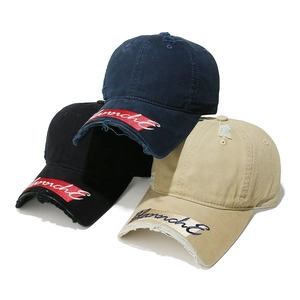 Detailed stacked view of distressed cotton baseball caps with embroidery and torn brim