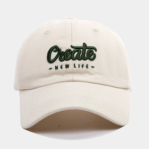 Beige cotton baseball cap with green 3D embroidered Create New Life lettering