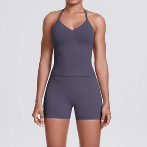 Detail of a purple seamless yoga set featuring a halter neck top and high-waisted shorts