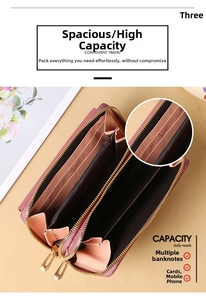 Macro view of the pink leather wallet interior showing multi-layer card slots and zippers