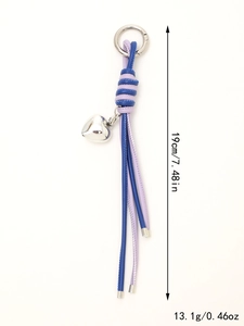 Detail view of woven leather keychain with heart charm, 19cm length and 13.1g weight