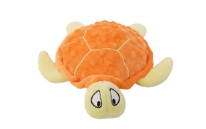 Close-up of orange plush turtle dog toy with dotted fabric texture on white background