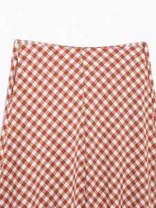 Close-up of red and white checkered skirt waist with invisible zipper detail