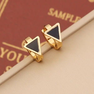 Minimalist gold stainless steel hoop earrings featuring black enamel triangle charms