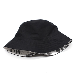 Detail of black cotton bucket hat showing reversible inner tie-dye marble print pattern
