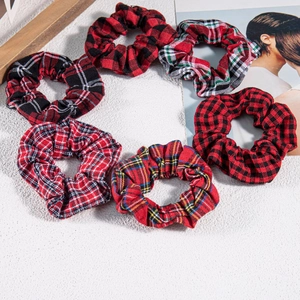 Set of six vintage red plaid hair scrunchies with classic tartan fabric patterns
