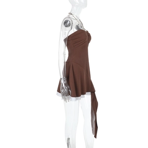 Detail view of brown bodycon dress with white tiered hem and silver chain neck strap