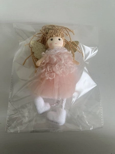 Detail view of pink tulle angel Christmas ornament with golden wings and plush shoes