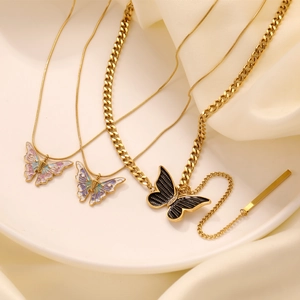Elegant gold butterfly pendant necklaces displayed on silk background for women