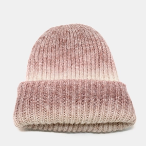 Detail of soft tie-dye gradient knit beanie with textured pink mohair wool fibers