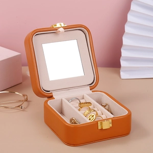 Portable orange velvet jewelry box with mirror and lock for rings and earrings