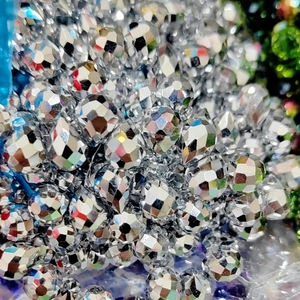 Macro shot of 8mm silver iridescent faceted crystal glass beads for DIY jewelry making
