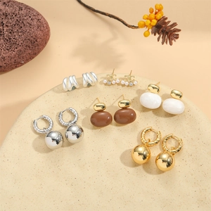 Set of 6 pairs vintage 14K gold plated earrings with pearls and resin on stone tray