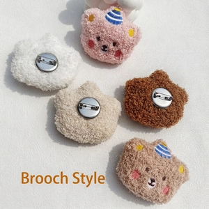 Plush cartoon bear brooches in five colors including pink, white, and brown with metal pins
