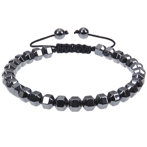 Close-up of heart magnetic stone bracelet with faceted grey beads and adjustable woven cord