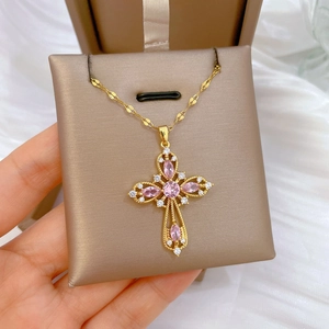 Gold titanium steel necklace featuring a hollow cross pendant with pink and white crystals