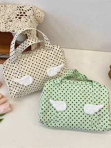 Polka dot travel toiletry bag with plush wings and top handle in two pastel colors