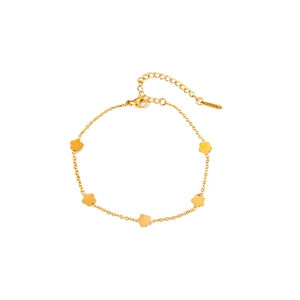 Detail of a minimalist gold flower bracelet with five petals on a plain white background