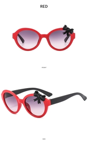 Front and side view of red bow kids sunglasses with purple gradient lenses