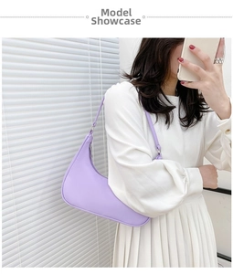 Detailed view of light purple nylon half-moon shoulder bag styled with a summer outfit