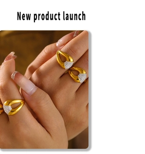 Detail of irregular geometric open ring with diamonds in 18k gold and silver finish