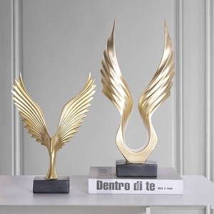 Abstract golden eagle wings sculptures on black base for modern home office desk decor