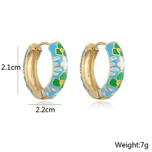 Detailed size view of gold enamel hoop earrings with blue and green floral patterns