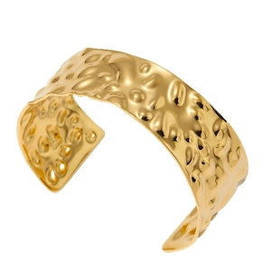Minimalist gold stainless steel open bangle featuring vintage textured hammered surface