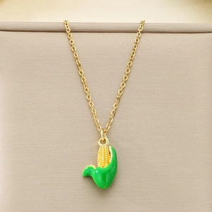 Sparkling crystal corn pendant necklace with green leaf detail on a gold chain