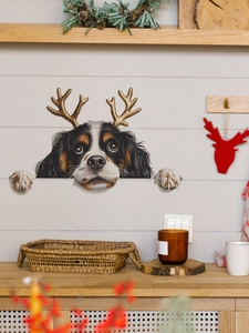 Close-up of a festive Christmas dog wall decal featuring a King Charles Spaniel with antlers