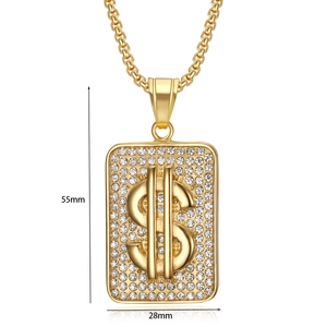 Close-up of a gold-plated dollar sign rectangular pendant with micro-pave crystals