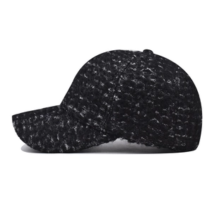 Winter baseball cap in black and white tweed fabric with warm fleece lining for cold weather